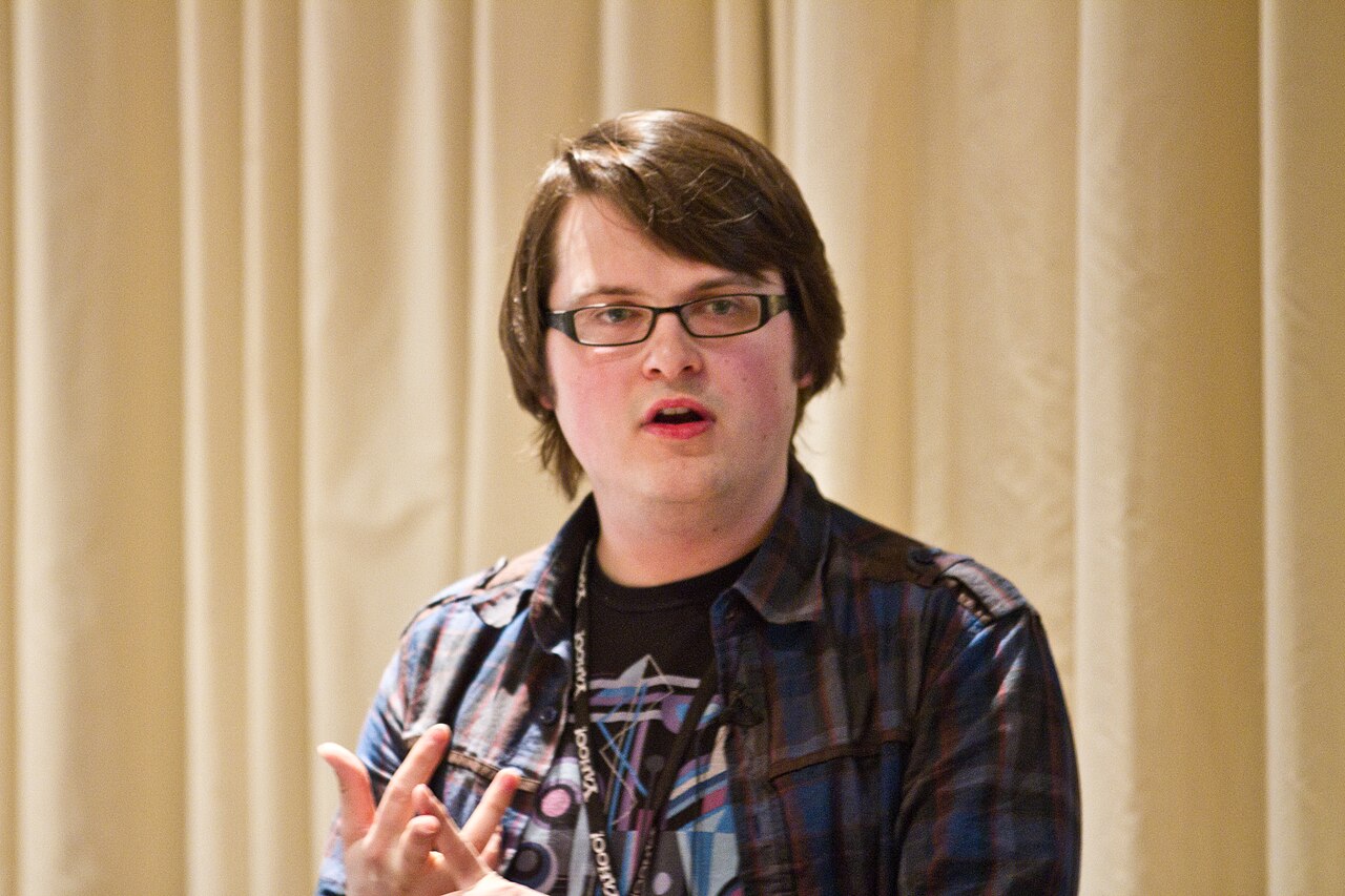 John Resig speaking onstage at JSConf US in April 2010